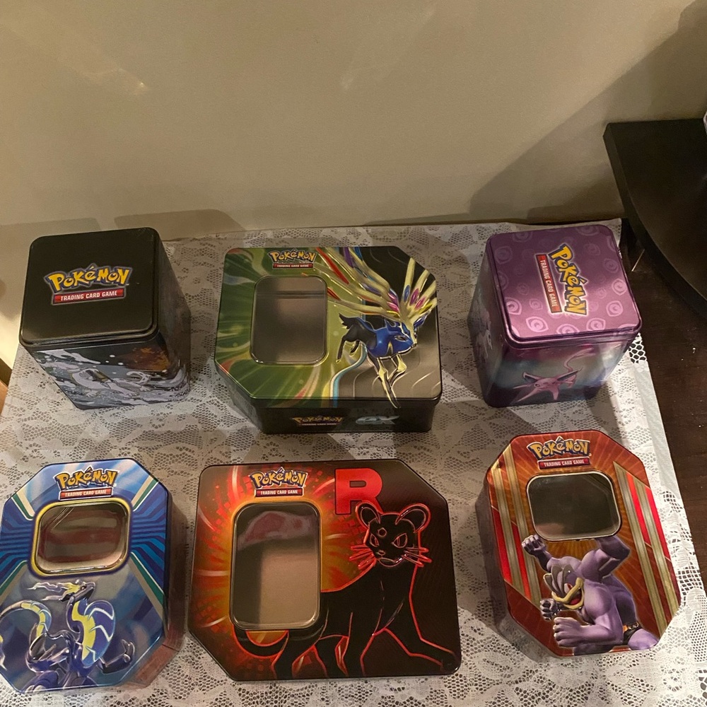 6 different Pokemon cool tins with no cards inside.
